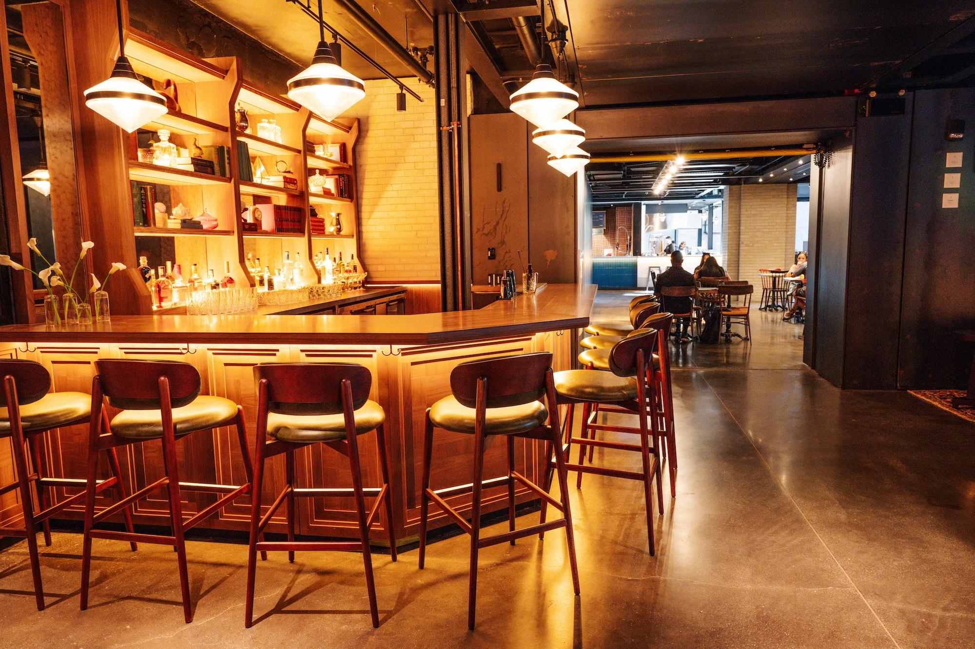 Bar with high leather covered stools in east annex lounge