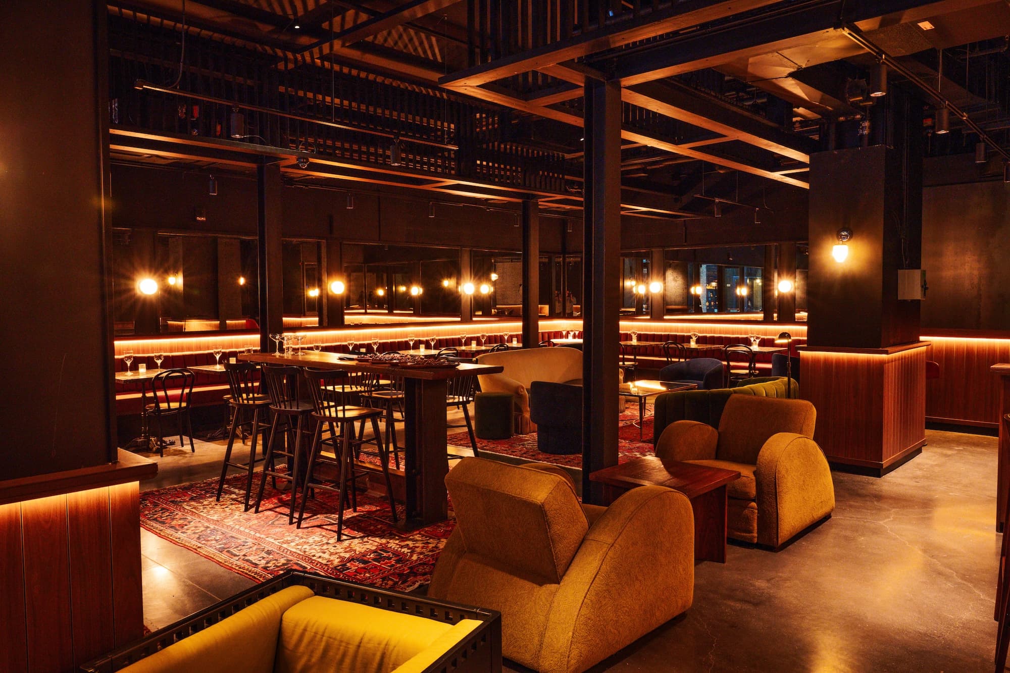 Leather banquette seating with small marble topped tables and comfortable chairs in the East Annex Lounge.