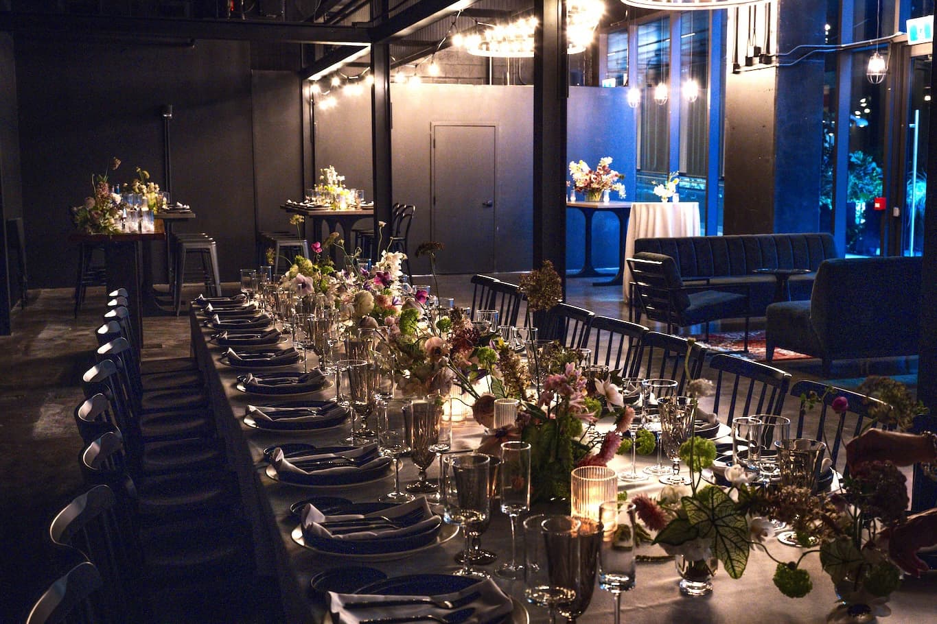 Long rectangular table set for dinner party.