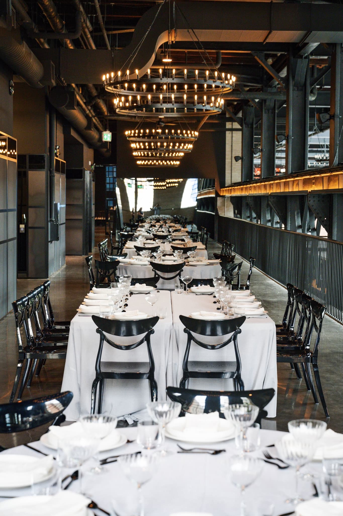 Long rectangular tables set for a corporate dinner