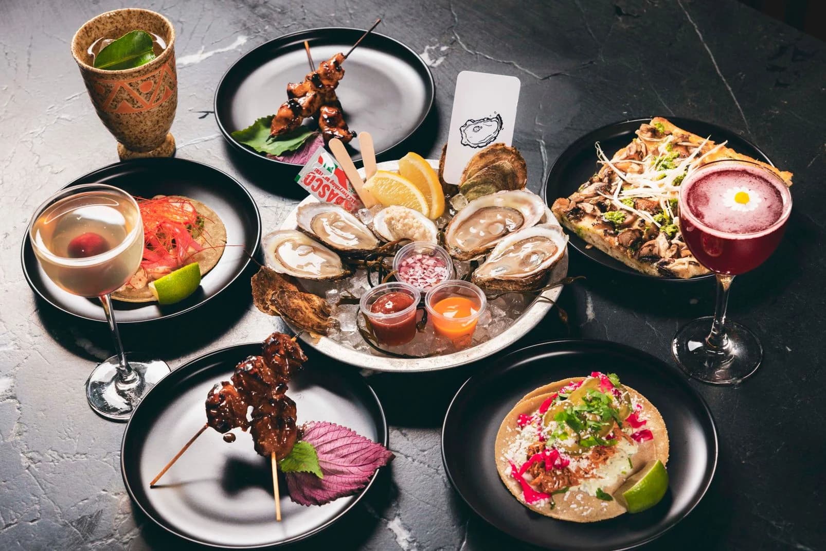 A collection of dishes and cocktails from Civil Works Cocktail Bar.