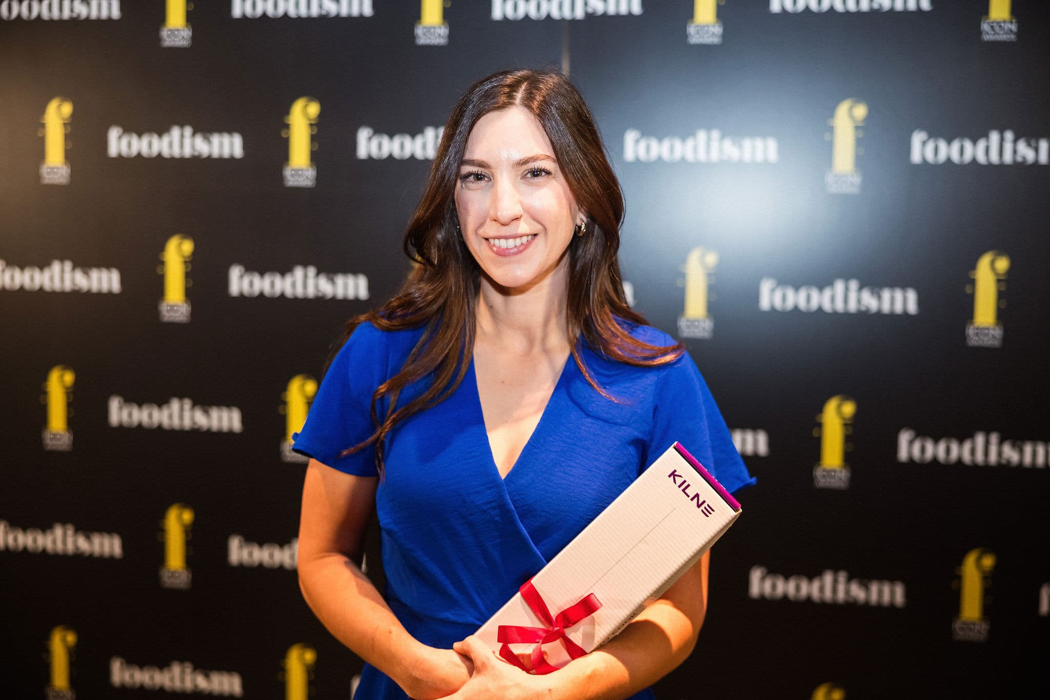 Bartender holding award